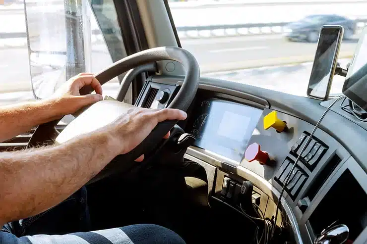 Truck driver holding the wheel