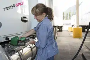 Woman fueling her semi