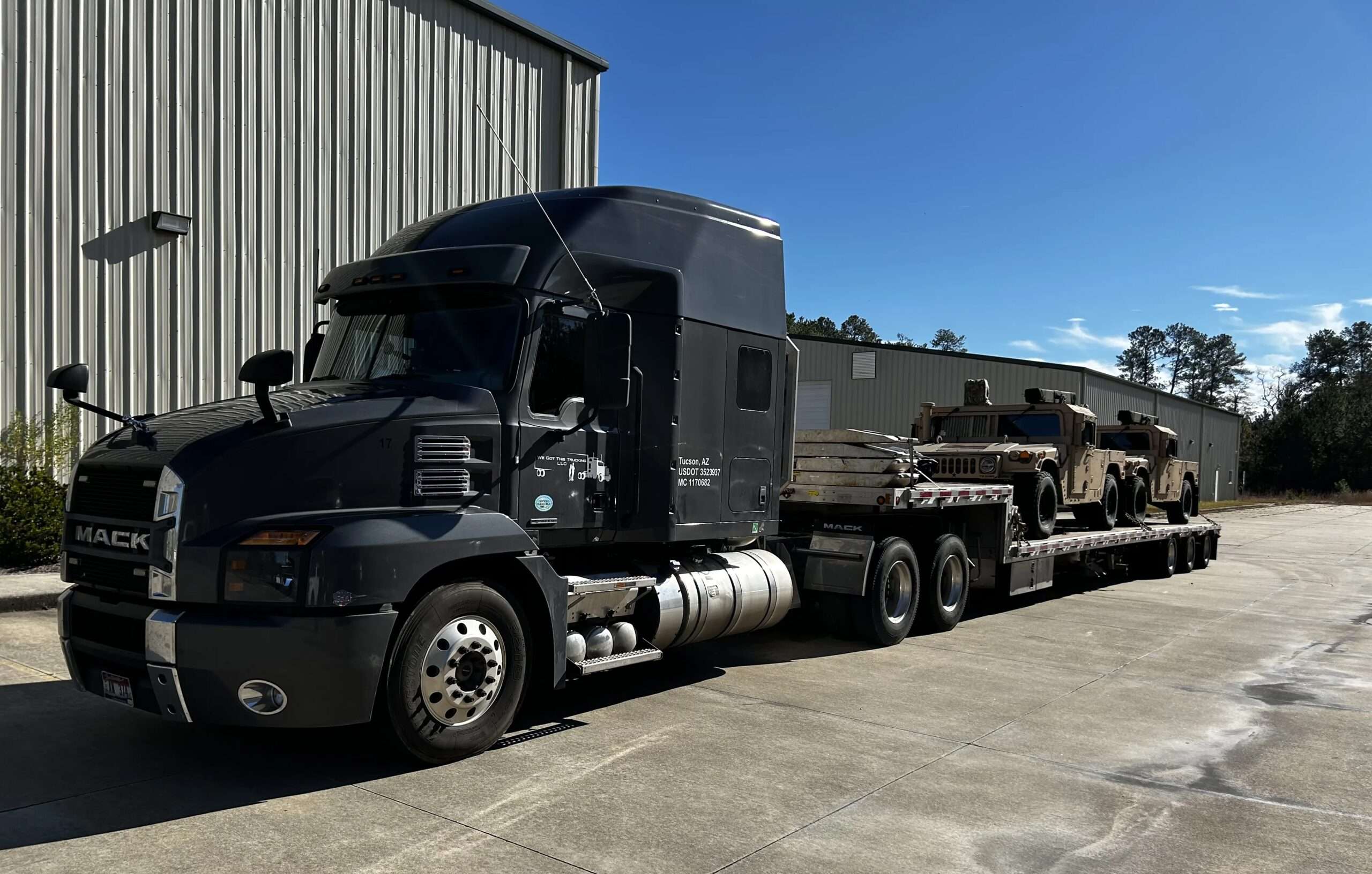 Truck dispatch services — flatbed haul secured by Freight Girlz