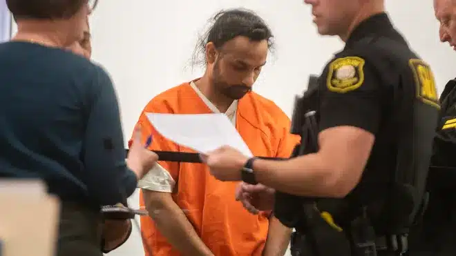 Authorities escort Harjinder Singh after arrest in Florida Turnpike semi-truck crash
